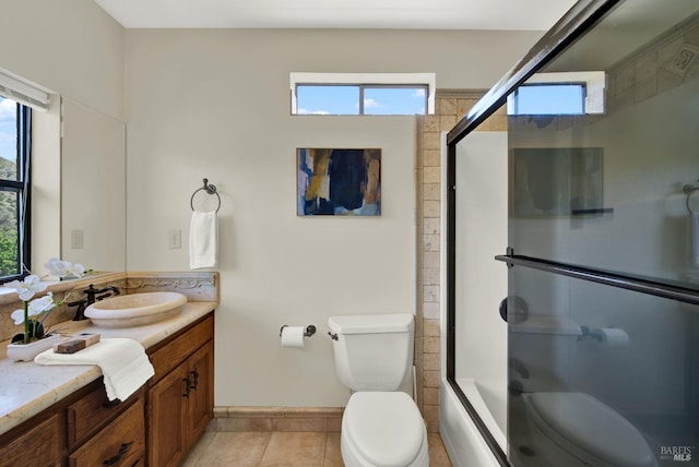 full bath with toilet and plenty of natural light