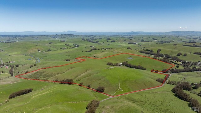 bird's eye view with a mountain view and a rural view