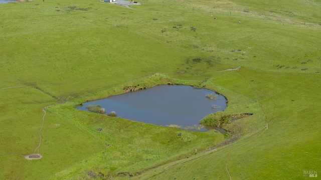 aerial view with a rural view and a water view