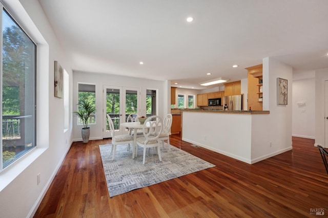dining space featuring dark wood-style flooring, baseboards, and recessed lighting