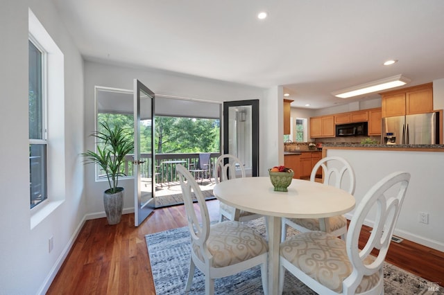 dining area featuring baseboards, recessed lighting, and light wood-type flooring