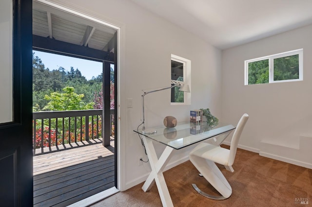 carpeted home office featuring baseboards