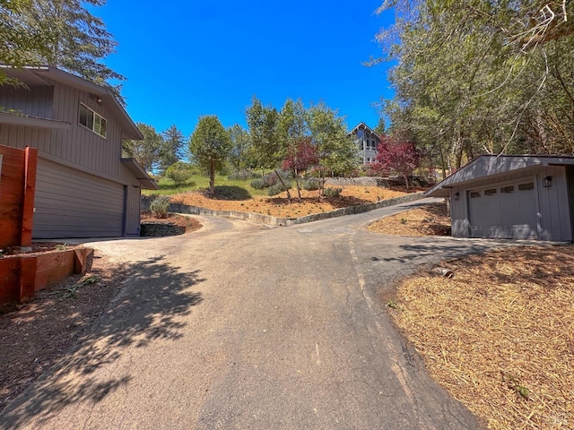 view of road featuring aphalt driveway