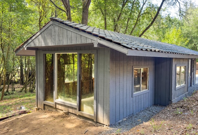 view of outdoor structure featuring a view of trees