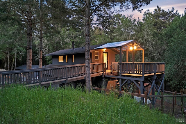 back of house featuring a deck