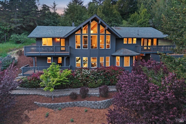 rear view of property with a balcony