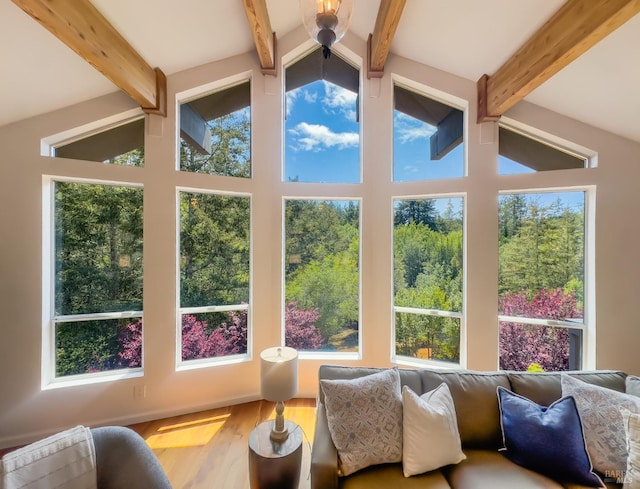 sunroom / solarium featuring beam ceiling