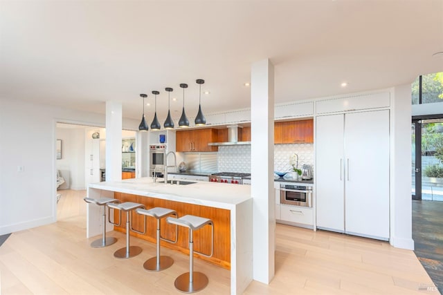 86 Sugarloaf Dr, Tiburon, CA 94920 - kitchen with light wood-style floors, modern cabinets, stainless steel oven, and a sink