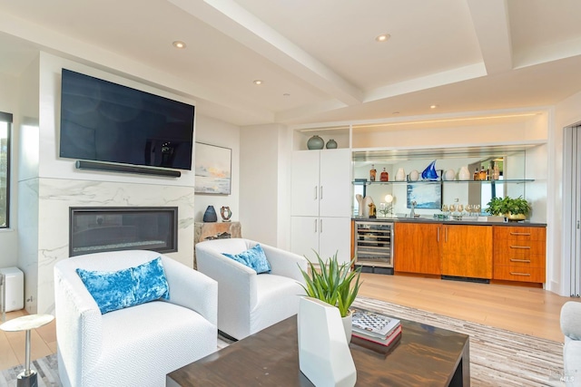 86 Sugarloaf Dr, Tiburon, CA 94920 - living room featuring beverage cooler, beam ceiling, light wood-type flooring, indoor wet bar, and a premium fireplace