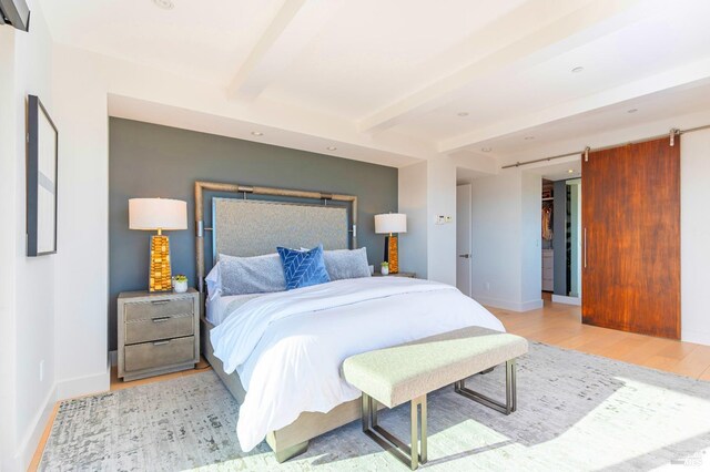 86 Sugarloaf Dr, Tiburon, CA 94920 - bedroom with recessed lighting, wood finished floors, a barn door, beamed ceiling, and baseboards