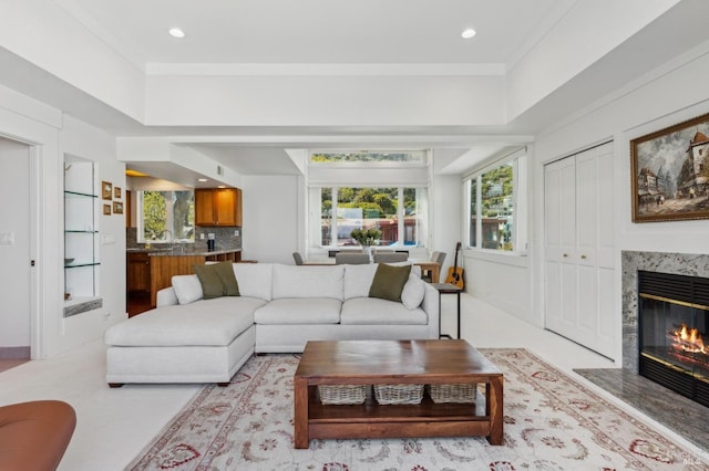living room with a fireplace, recessed lighting, and plenty of natural light