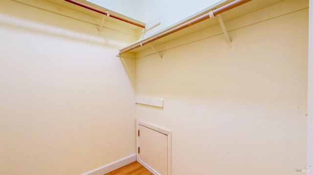 walk in closet featuring light wood-type flooring