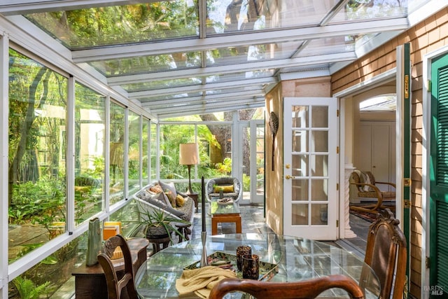 sunroom / solarium with outdoor dining area and a wealth of natural light