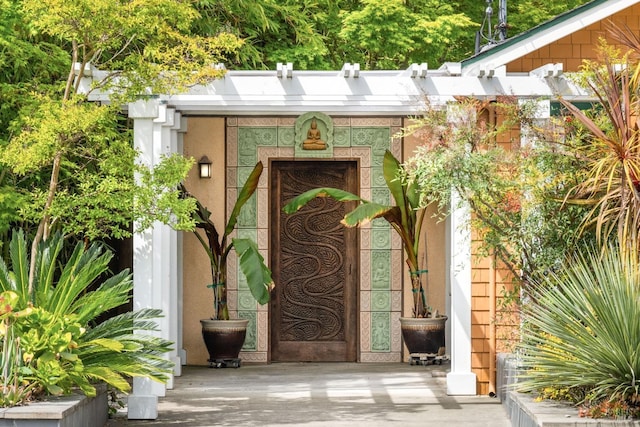doorway to property with stucco siding