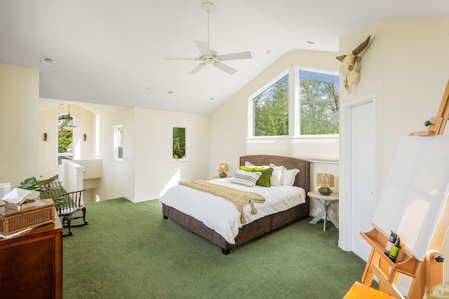 bedroom featuring lofted ceiling, a ceiling fan, and carpet flooring