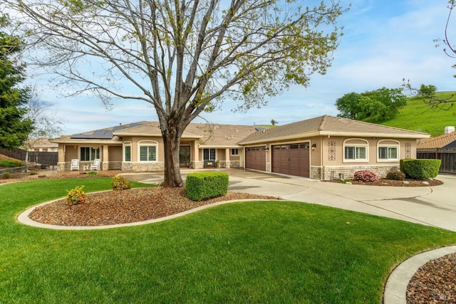 6121 N Vine St, Vacaville, CA 95688 - single story home featuring stone siding, stucco siding, an attached garage, and solar panels