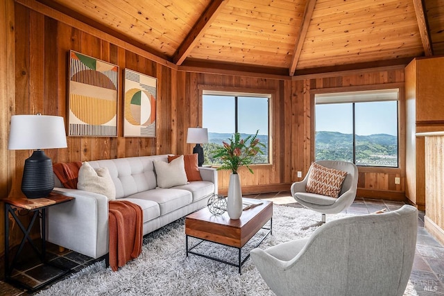 living room with lofted ceiling with beams, wooden ceiling, and wood walls