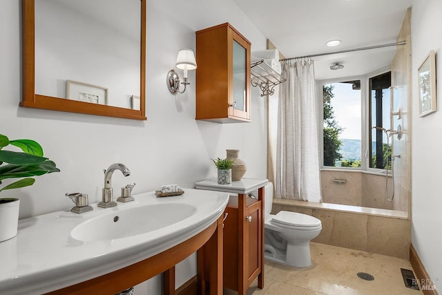 full bathroom with recessed lighting, shower / tub combo, toilet, and visible vents