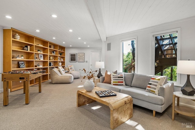 living area with beam ceiling, wooden ceiling, carpet flooring, and recessed lighting