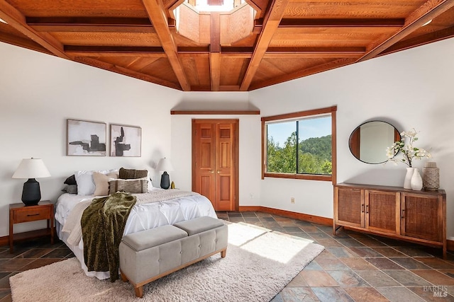 bedroom featuring wood ceiling, stone tile flooring, coffered ceiling, baseboards, and beam ceiling