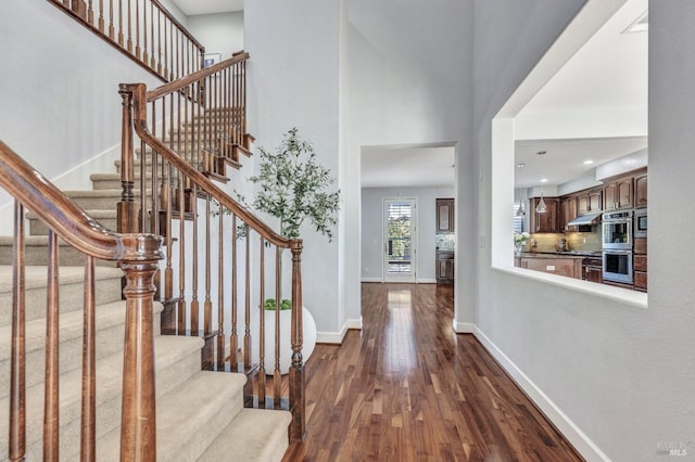 439 Mckenna Ct, Benicia, CA 94510 - entrance foyer featuring stairway, a high ceiling, dark wood finished floors, baseboards, and recessed lighting
