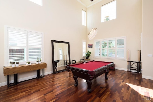 recreation room featuring crown molding, wood finished floors, pool table, baseboards, and a high ceiling