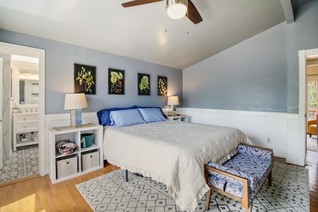 7600 Scenic Ct, Fair Oaks, CA 95628 - bedroom with wood finished floors, a wainscoted wall, lofted ceiling, a sink, and ensuite bathroom