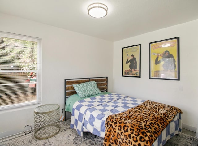 bedroom featuring baseboards