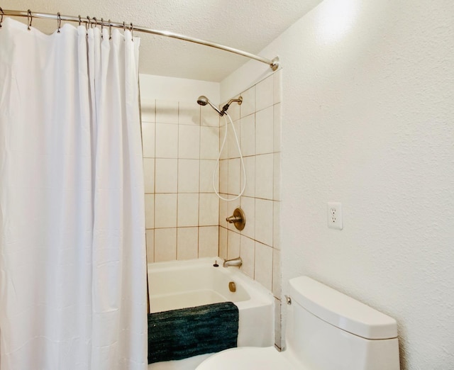bathroom with shower / bathtub combination with curtain, toilet, and a textured ceiling