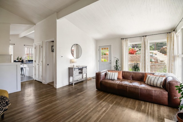 living room with baseboards, vaulted ceiling with beams, and wood finished floors