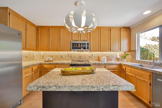 119 Philip Dr, Healdsburg, CA 95448 - kitchen featuring appliances with stainless steel finishes, a sink, backsplash, and a center island