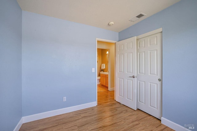 119 Philip Dr, Healdsburg, CA 95448 - unfurnished bedroom with baseboards, light wood-style flooring, and a closet