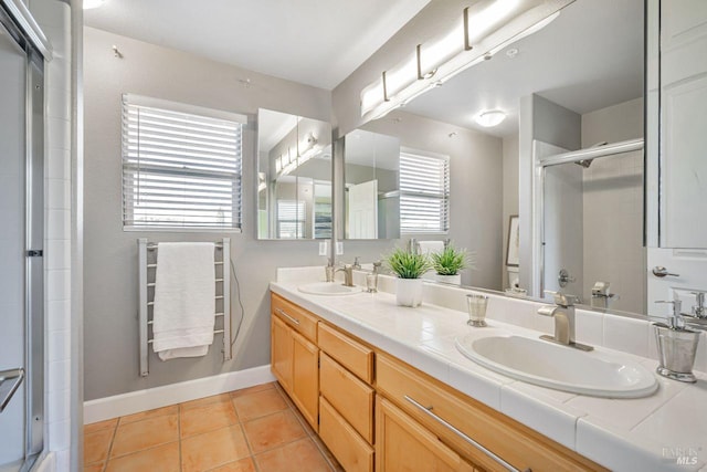119 Philip Dr, Healdsburg, CA 95448 - full bathroom with toilet, a shower with door, double vanity, tile patterned flooring, and baseboards