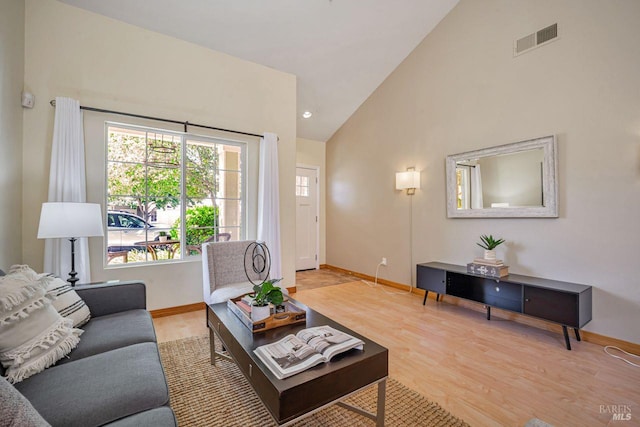119 Philip Dr, Healdsburg, CA 95448 - living area featuring baseboards, light wood-type flooring, and high vaulted ceiling