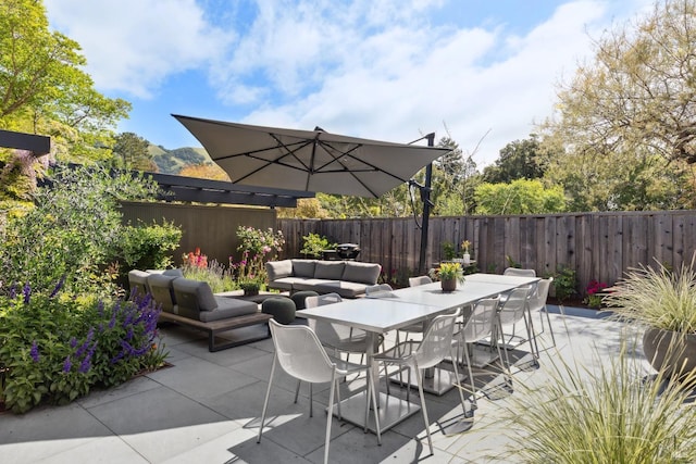 view of patio / terrace with a fenced backyard and outdoor dining area