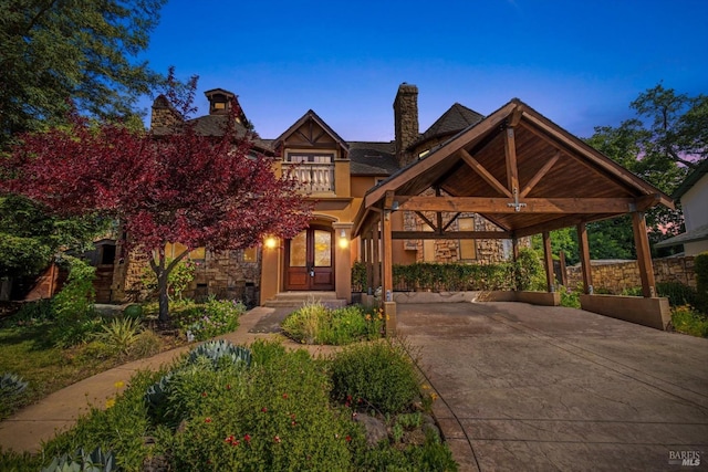 149 Auburn Way, Vacaville, CA 95688 - view of front of property with a chimney, french doors, a carport, concrete driveway, and stone siding