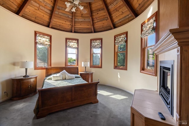 149 Auburn Way, Vacaville, CA 95688 - carpeted bedroom featuring a glass covered fireplace, beam ceiling, baseboards, high vaulted ceiling, and wooden ceiling