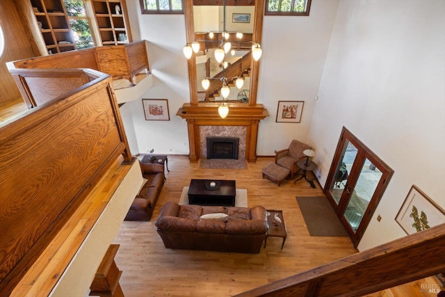 149 Auburn Way, Vacaville, CA 95688 - living area featuring a towering ceiling, wood finished floors, and a fireplace
