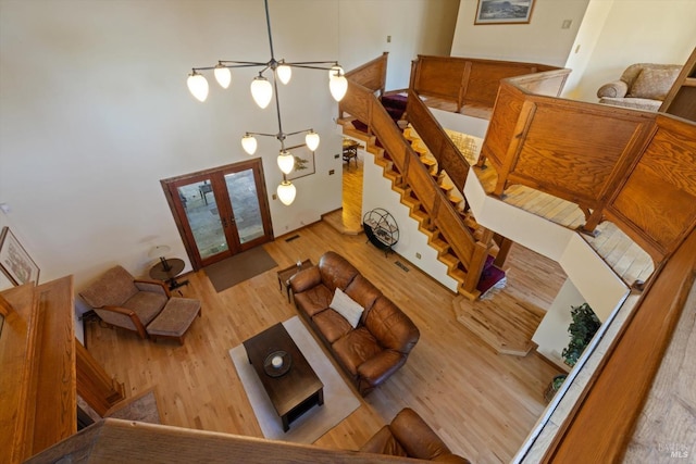 149 Auburn Way, Vacaville, CA 95688 - foyer with french doors, stairs, a towering ceiling, and wood finished floors
