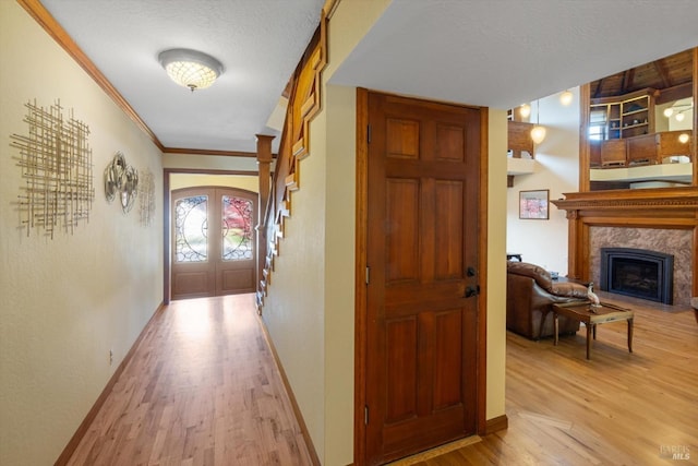 149 Auburn Way, Vacaville, CA 95688 - hallway featuring baseboards, ornamental molding, french doors, and light wood finished floors