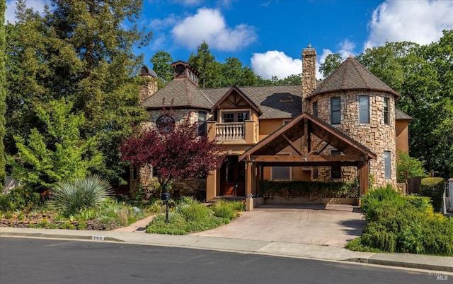 149 Auburn Way, Vacaville, CA 95688 - view of front of property featuring a chimney, stucco siding, a balcony, and stone siding