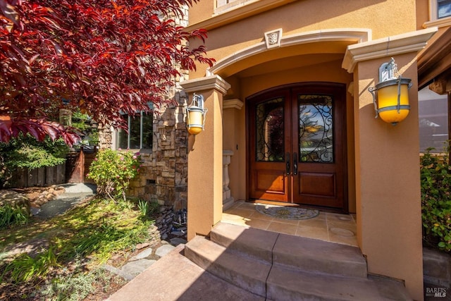 149 Auburn Way, Vacaville, CA 95688 - property entrance featuring stucco siding, french doors, and stone siding