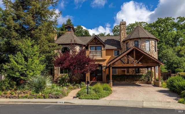 149 Auburn Way, Vacaville, CA 95688 - tudor-style house featuring a carport, stucco siding, driveway, and stone siding