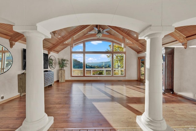 unfurnished living room with wood ceiling, hardwood / wood-style flooring, and ornate columns