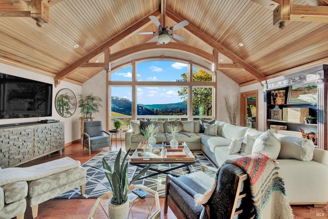 living room featuring wooden ceiling, baseboards, a ceiling fan, and wood finished floors