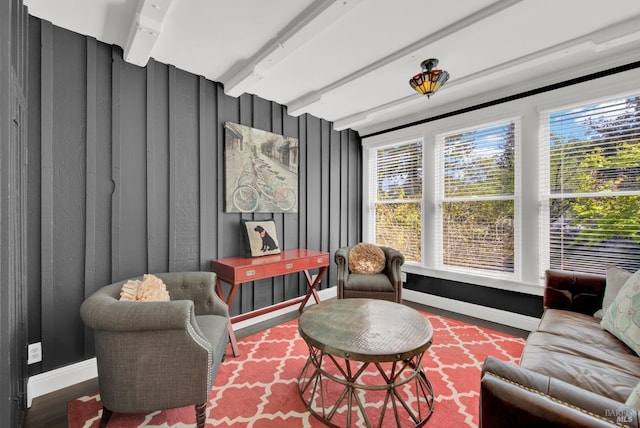 sitting room with wood finished floors and baseboards