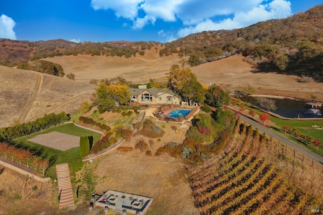 aerial view featuring a rural view and a mountain view