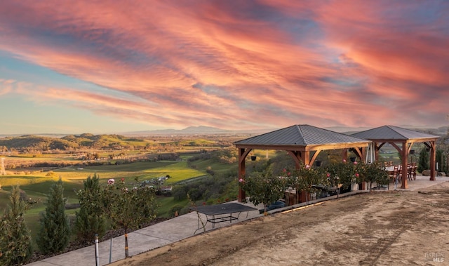 exterior space with a gazebo and a mountain view