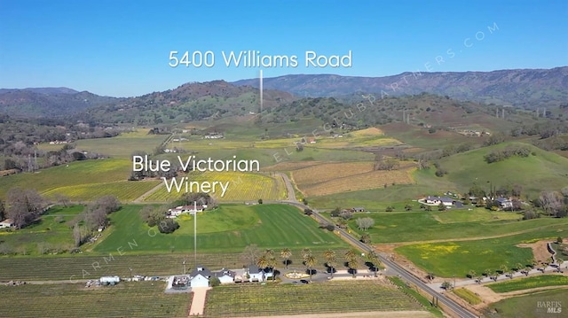 aerial view featuring a rural view and a mountain view