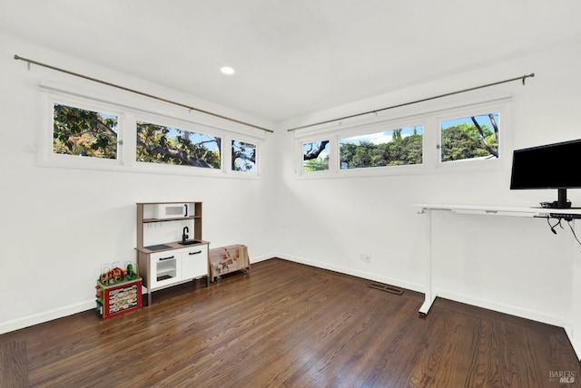 game room featuring visible vents, wood finished floors, baseboards, and recessed lighting